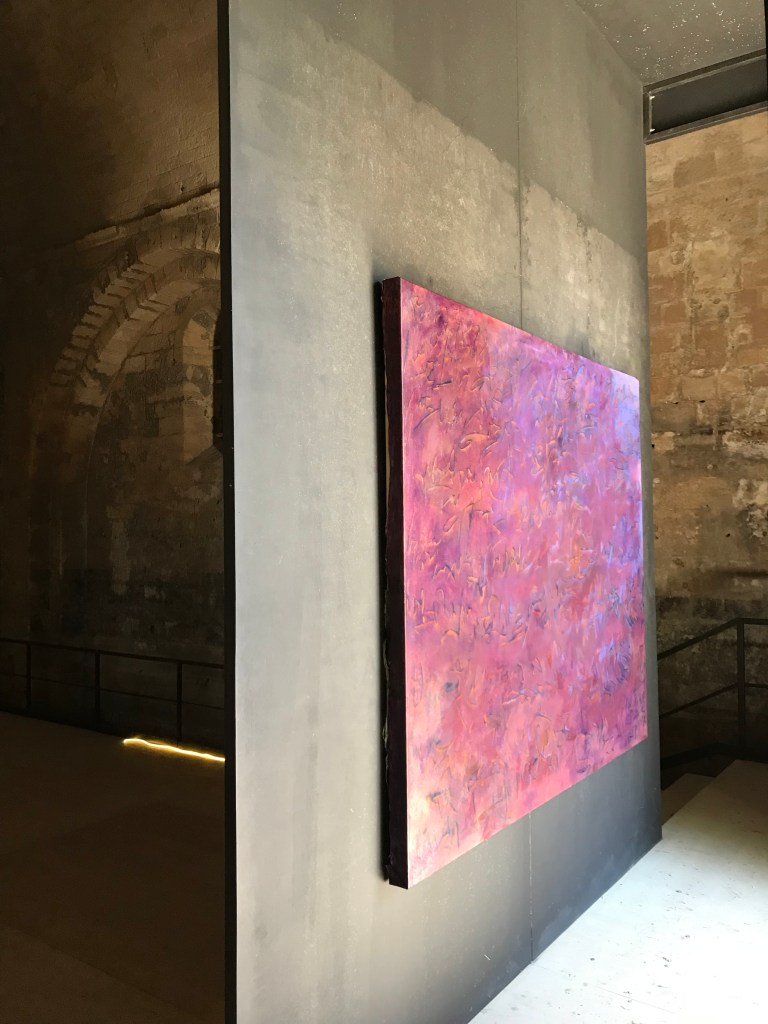 abstract reddish purple text-oriented painting by Diana Hajji